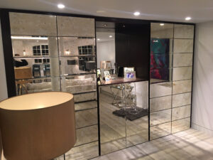 Antique Roman mirror glass used on cupboard doors and drawer fronts for a bespoke interior