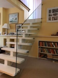 Glass balustrade installed alongside a staircase in a residential home
