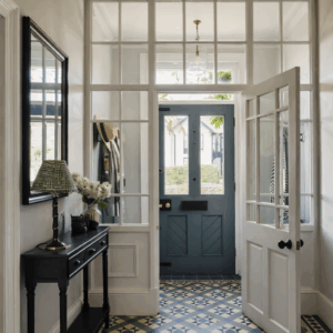 Hallway wall mirror positioned opposite a front door to maximise light