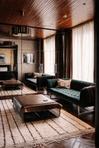 Mirrored wall panels creating depth and reflection in a stylish living room