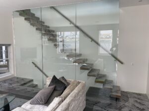 Bespoke glass staircase balustrade and enclosure installation