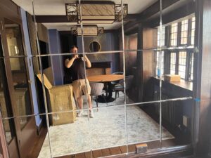 Completed paneled mirror wall with beveled edges