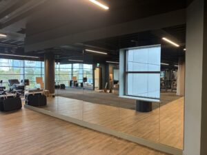 Commercial gym mirrored wall installation