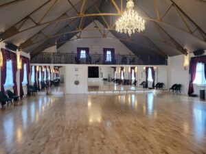 Commercial mirrored wall installation in a large event hall