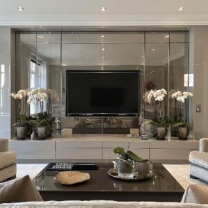 Mirrored TV wall in a luxury living room with bespoke mirror panels