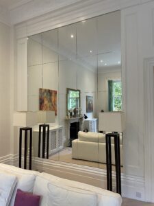 Multi panel mirrored wall in a residential living room