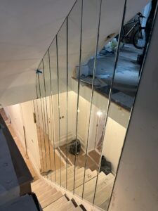 Vertical mirror panels installed along staircase
